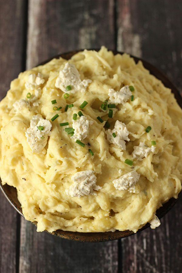 Beautiful golden mashed potatoes topped with Boursin Cheese and fresh chives.  