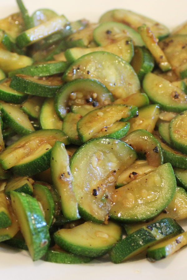 A big platter is full of sauteed zucchini glazed with a simple Asian Hoisin sauce glaze.