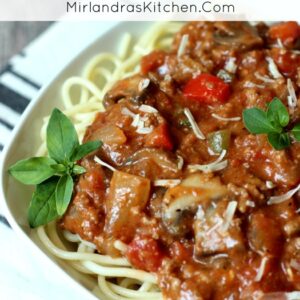 This unique Spaghetti Sauce has a bold, deep flavor from tons of herbs, peppers, mushrooms, a few surprise ingredients, and plenty of beef! It is a great cook and freeze recipe for busy nights!