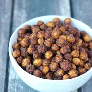 Cinnamon roasted chick peas in a bowl. This is a easy, healthy snack that is fast to bake in the oven.