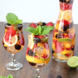 This white sangria is the perfect sweet, fruity, wine drink to serve at a BBQ or cool off with all summer long. I can never decide if the best part is the drink itself or munching on the delicious wine soaked fruit after!