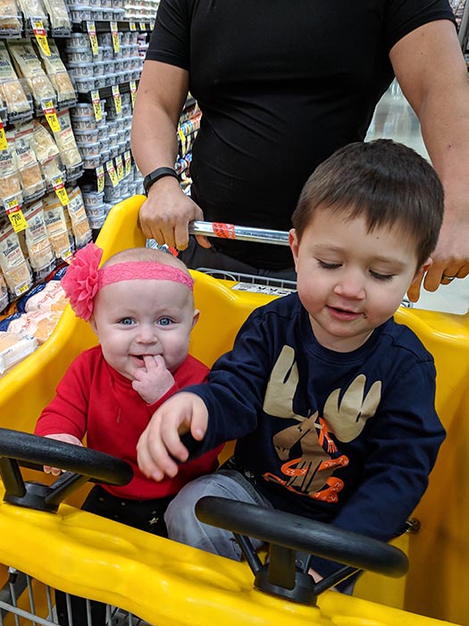 Jack Lionheart and Elora in a Taxi Cab shopping cart at Albertsons on Broadway.  