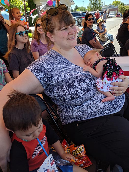 Baby Ella sleeping on mom's chest at a BBQ in Boise.