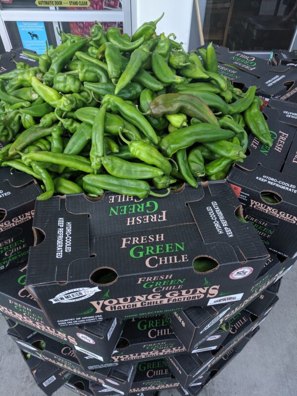 PIles of Hatch Chile peppers wait for Roasting at Albertsons in Boise, ID.