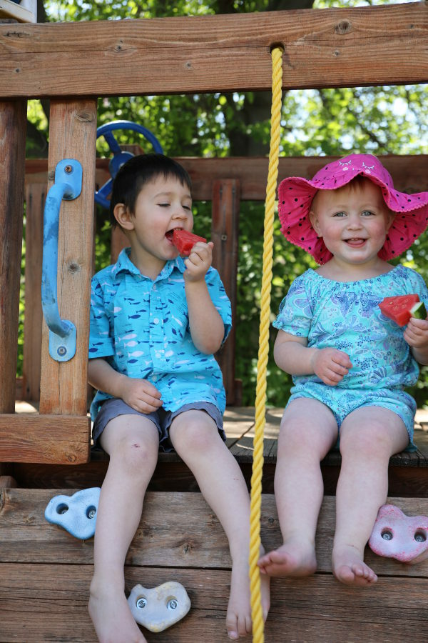 Jack and Ella in their play house eating watermelon trees. 