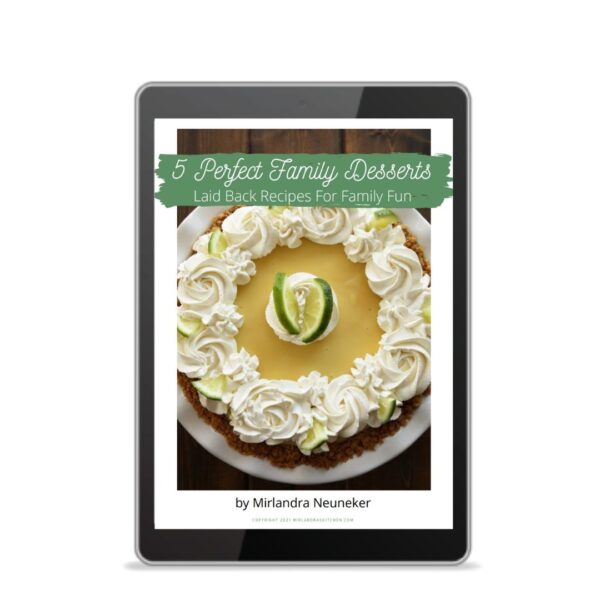 The cover of the cookbook Five Perfect Family Desserts shows on an Ipad.