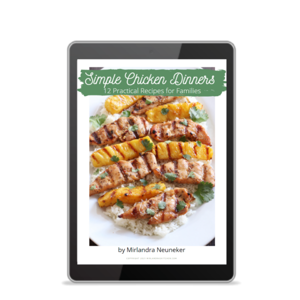 Cover of the Simple Chicken Dinners Cookbook showing grilled chicken and pineapple on rice.