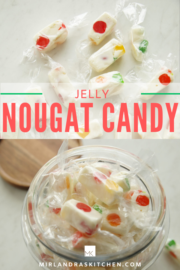pinterest image for jelly nougat candy. Pretty white candy with rainbow jelly chunks in it. Each candy is wrapped in a clear wrapper in a jar or on the table by the jar.