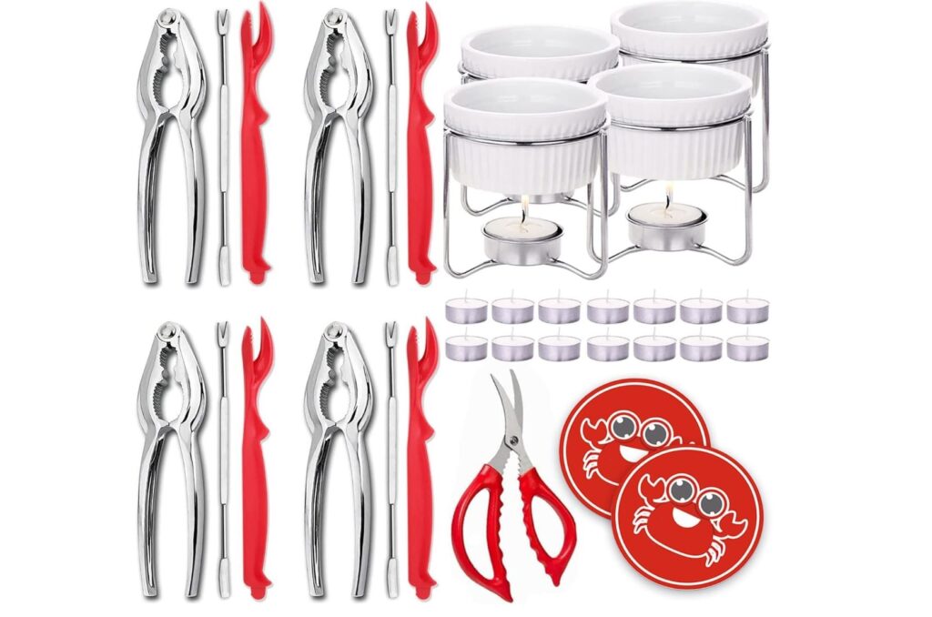 crab dinner set with crackers and picks and scissors and butter dishes with warming candles