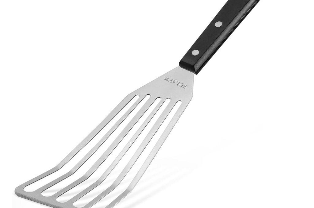 flexible fish turning spatula with black heat resistant handle