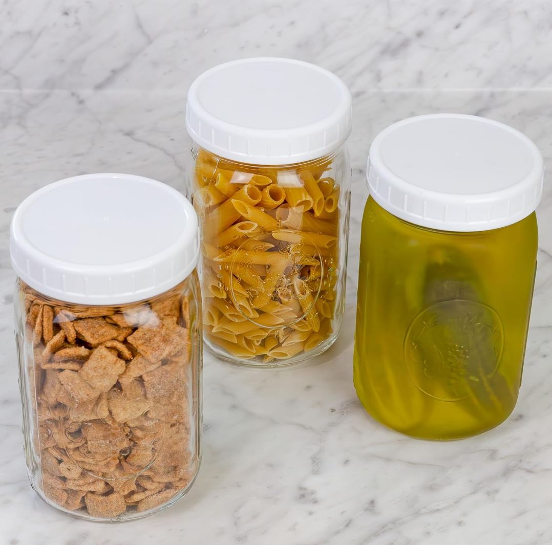 plastic screw on white jar lids on mason jars full of snacks and pickles