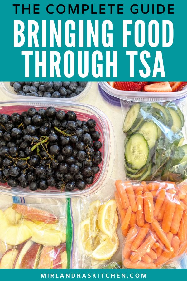 Pinterest image taking food through TSA. You see containers and bags of veggies and fruit including cucumbers and grapes and blueberries.