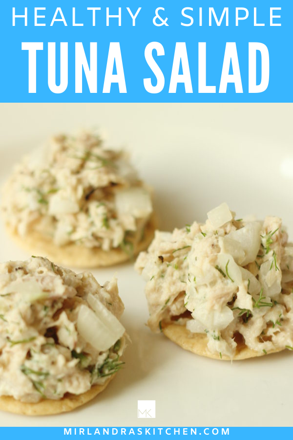 This is a promo image for healthy tuna salad recipe. It pictures crackers topped with a tasty, healthy tuna salad and features words for Pinterest.