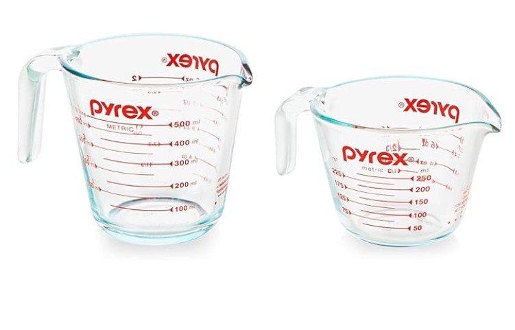 Two pyrex measuring cups. A 2 cup and a 1 cup