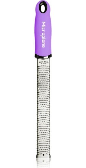 A microplane zester with purple handle.