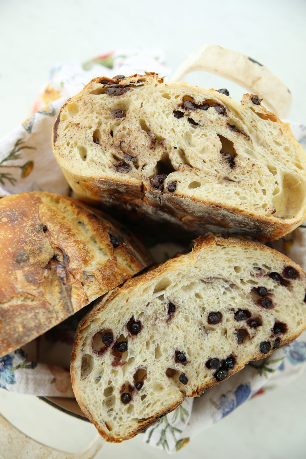 Sliced sourdough loaves with chocolate and blueberry inclusions showing even crumb distribution, a great example of sourdough inclusion ideas